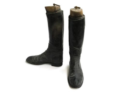 A pair of gent's black hunting boots, some patching, approximately size 8.5, with wooden trees 
