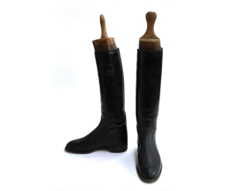 A pair of gent's black hunting boots, some patching, approximately size 8.5, with wooden trees 
