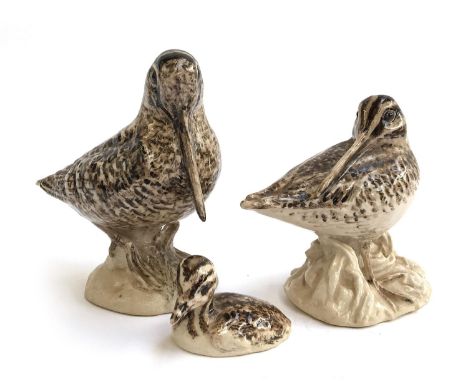 A group of ceramic sculptures including a woodcock and chick, and a snipe (3) 