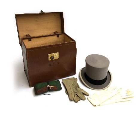 A 'The City Trunk Stores', London EC2 leather top hat box, with a Hillhouse &amp; Co, London, grey felt top hat; together wit