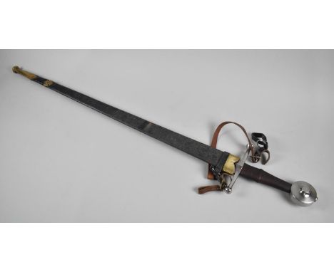 A Reproduction Broad Sword in Brass Mounted Leather Scabbard