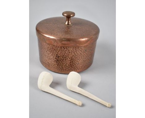 An Army and Navy Hand Beaten Copper Circular Tobacco Pot with Lid and Complete with Two Clay Pipes, 14cms Diameter 