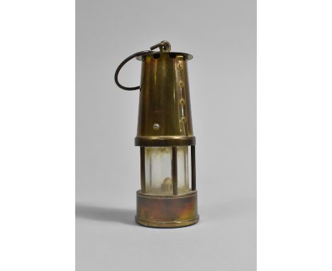 A Miniature Brass Miners Safety Lamp, 13cms High 