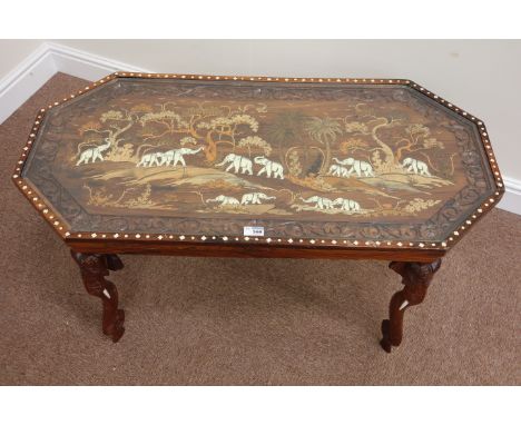 Anglo-Indian coffee table, heavily inlaid with elephant scenes, raised on elephant trunk legs, 50cm x 102cm, H48cm,  Conditio