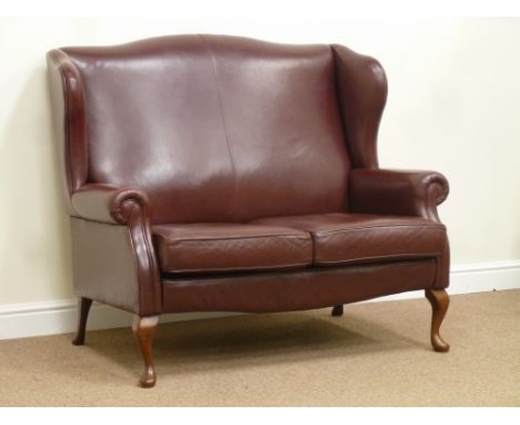 Sherborne two seat wing back sofa upholstered in burgundy leather, W133cm Condition Report Click here for further images, con