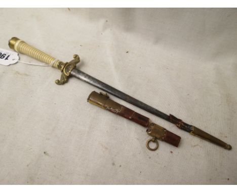 A Georgian naval dirk, turned ivory handle with brass cross guards having upturned cast leaf ends, brass cap with lion  mask 