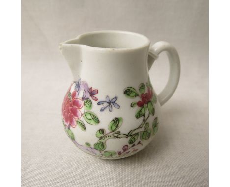 A small bow porcelain sparrow beak cream jug, floral polychrome decoration, 18th century, 2 5/8 high