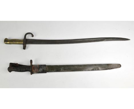 A French sword bayonet, 69cm long,  and an American 1918 pattern bayonet, bearing factory stamps, with leather scabbard, 58cm