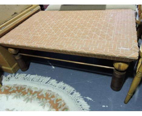 A rectangular mosaic terracotta tile coffee table, on woven ball mounted cylindrical supports, W. 118cm.