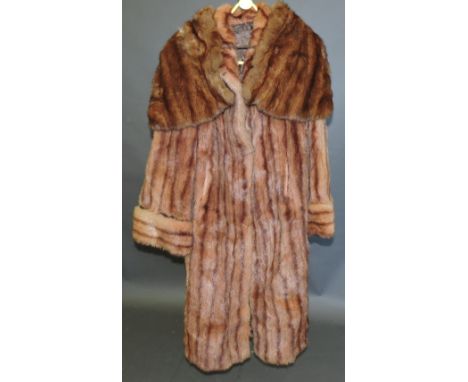 A ladies' three-quarter length musquash coat, with a brown satin lining, together with a fur mantle. (2)