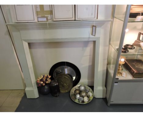 A 1920s white painted oak fire surround.