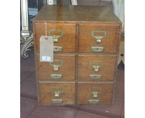 A vintage Advance patent oak six drawer tabletop filing cabinet, with brass cup handles, W. 38cm.
