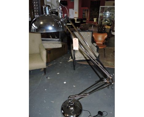 A large chromium plated anglepoise standard lamp with circular solid shade.