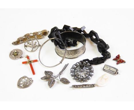 An assortment of vintage and costume jewellery, to include a vulcanite chain, a coral and yellow metal cross pendant, two Vic