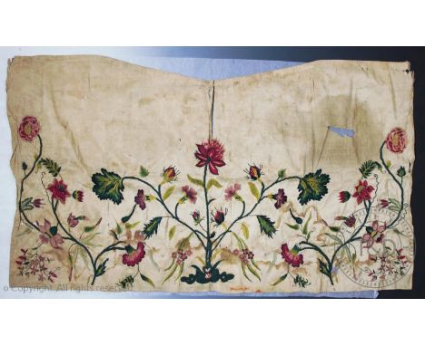 An early 19th century embroidered silk panel, in the oriental style, designed as fuchsias, peonies and other assorted British