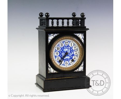 A Lewis F Day Aesthetic movement clock, late 19th century,with a spindle gallery above the 12cm blue and white fruit pattern 