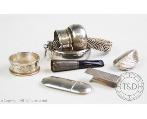 A selection of silver and silver coloured items, comprising: a silver hinged bangle, C P S Jewellery Co Ltd, Birmingham 1971,
