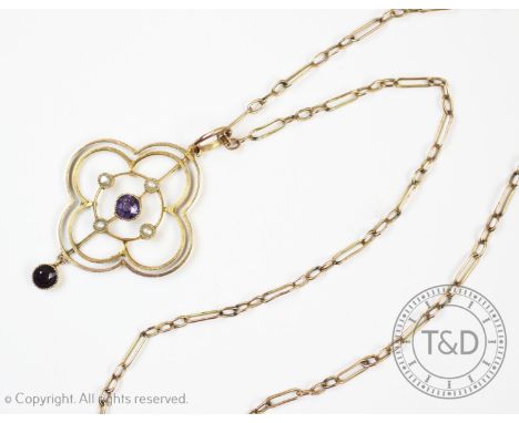 An Edwardian seed pearl and amethyst set pendant, of openwork quatrefoil form and drop set with amethysts and seed pearls, pa