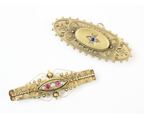 A Victorian 15ct gold diamond and ruby set bar brooch, Birmingham 1900, with etruscan detailing and alternate claw set ruby a