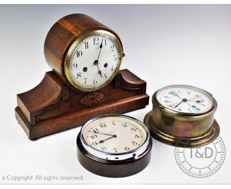 An early 20th century oak cased drum mantel clock, with a 15cm white enamel dial and two train movement striking on a coil, 2