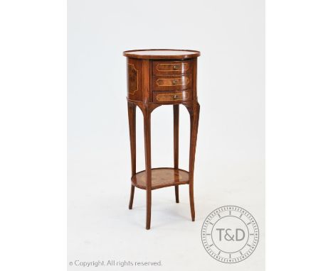 A reproduction walnut and burr yew lamp table, 20th century, the circular tray top centred with a burr yew panel, above three