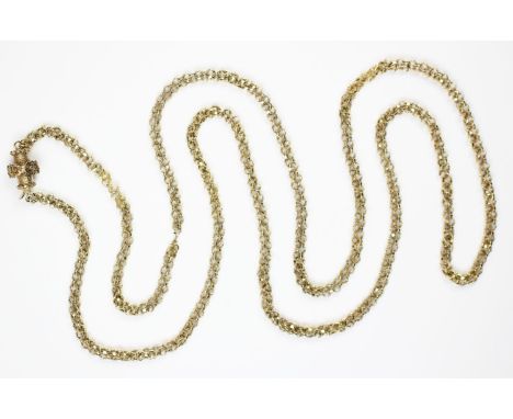 A 19th century muff chain, the fancy link chain measuring 123cm, barrel clasp with applied floral decoration, gross weight 34