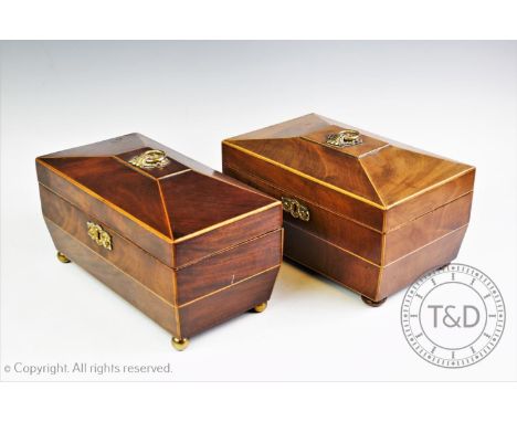 A George IV mahogany tea caddy with two hinged and lidded compartments, the caddy of sarcophagus form with ornate gilt metal 