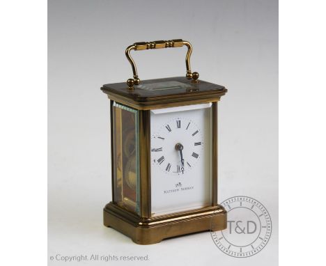 A brass cased carriage timepiece by Matthew Norman, with a 5cm white enamel dial, signed with the makers name and a single tr