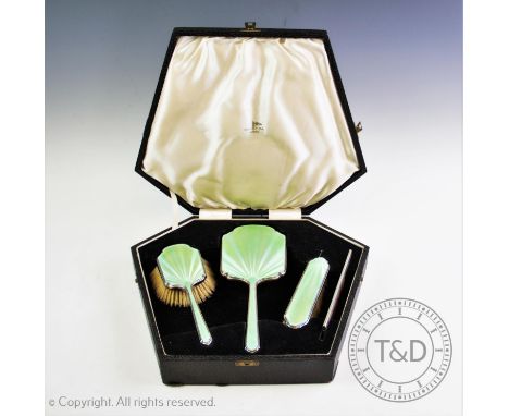 A Walker &amp; Hall enamel and silver mounted dressing table set, Walker &amp; Hall, Sheffield 1948, comprising a hand mirror