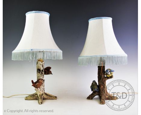 Two Goebel ceramic table lamps modelled as tree stumps with perching birds, one with blue tits, the other with wrens, each wi