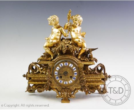 A late 19th century gilt metal French figural mantel clock, stamped P H Mourey (French 1840 - 1910), the clock surmounted wit
