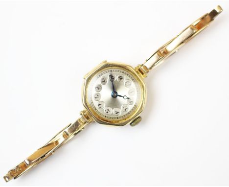 A lady's continental 18ct gold wristwatch, the engine turned dial with Arabic numerals, case size 21mm, attached expanding ye