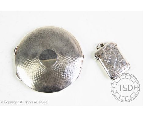 An Edwardian silver vesta case, Smith &amp; Bartlam, Birmingham 1904, with clover form relief, vacant cartouche and a hinged 