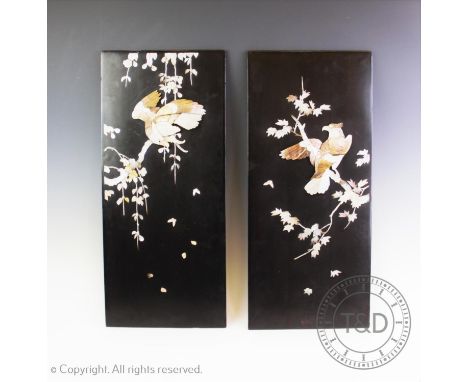 A set of four Japanese shibayama panels, Meiji period (1868-1912), each black lacquered rectangular panel applied in mother o