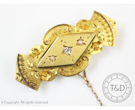 A Victorian diamond and pearl set 15ct gold memorial brooch, Chester 1890, the central old cut diamond flanked by two seed pe