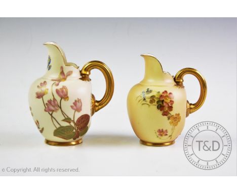 Two Royal Worcester blush ivory flat back miniature jugs, each decorated with hand painted floral sprays, with gilded handle,