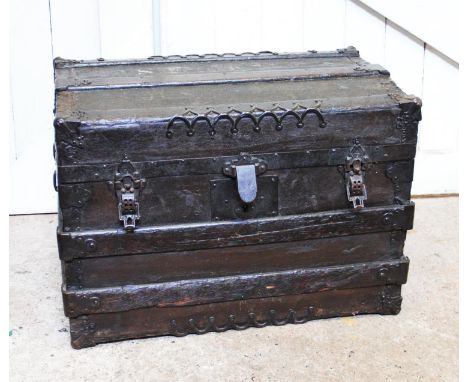 A vintage American travel trunk, of rectangular form,  with applique metal details and hinged clasp, stamp to the interior re