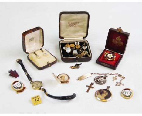 A lady's wristwatch stamped '9ct', with an assortment of yellow metal pendants and mounts, a selection of shirt studs (two st