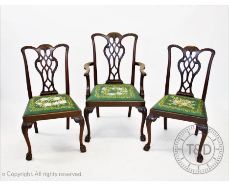 A set of five Chippendale style mahogany dining chairs, 20th century, each chair with an interlaced splat back above a drop i