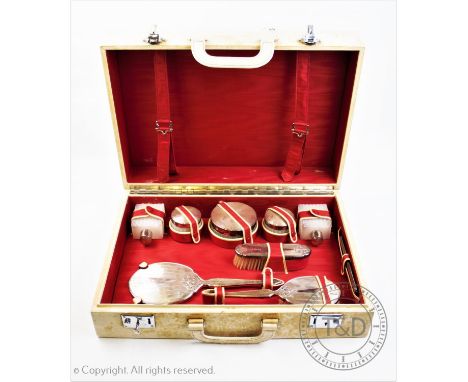 A 20th century silver topped harlequin dressing set, comprising two silver topped perfume bottles and three pots, 'T P', Lond