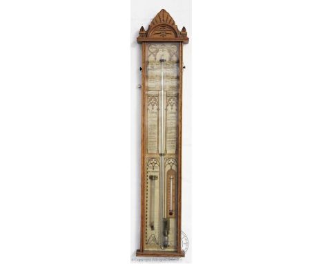 A Victorian oak cased Admiral Fitzroy wall barometer, the architectural case enclosing the paper back, stamped with the regis