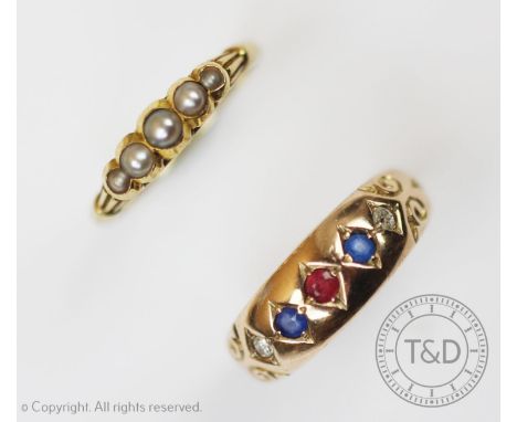 A five stone 9ct gold ring set with ruby, sapphire and diamond claw set to yellow gold, engraved decoration to shoulders, hal