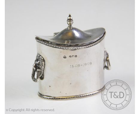 An Edwardian silver tea caddy, William Aitken, Birmingham 1910, of plain polished oval form, the two handles each with lion h
