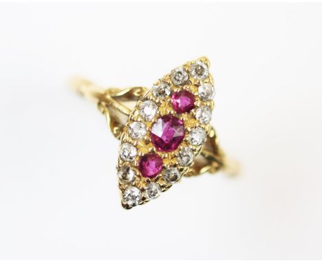 An Edwardian ruby and diamond ring, Birmingham 1903, the marquise shaped ring set with three central graduated rubies within 