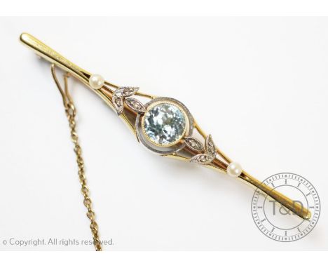 A belle epoque zircon, diamond and seed pearl set bar brooch, designed as a central millegrain collet set zircon, flanked by 