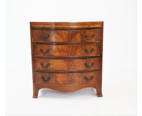 A George III style mahogany bowfront chest of drawers, with a brushing slide above four long cock beaded drawers, applied wit