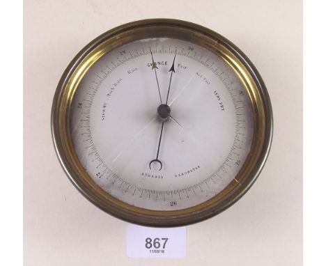 A brass circular marine barometer and a later barometer
