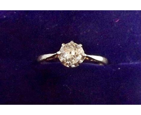 An 18 carat gold diamond solitaire ring, size K