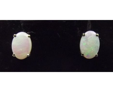 A pair of 9 carat white gold opal stud earrings