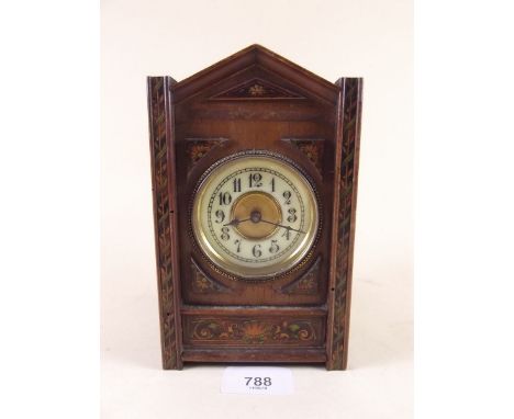 A small mahogany mantel clock with marquetry transfer decoration - 18cm